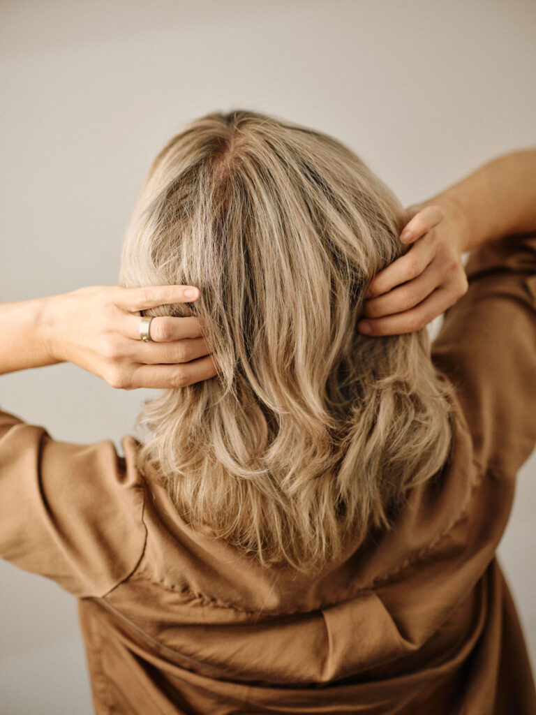 Blonde hair colour with soft dimensional tones and natural movement