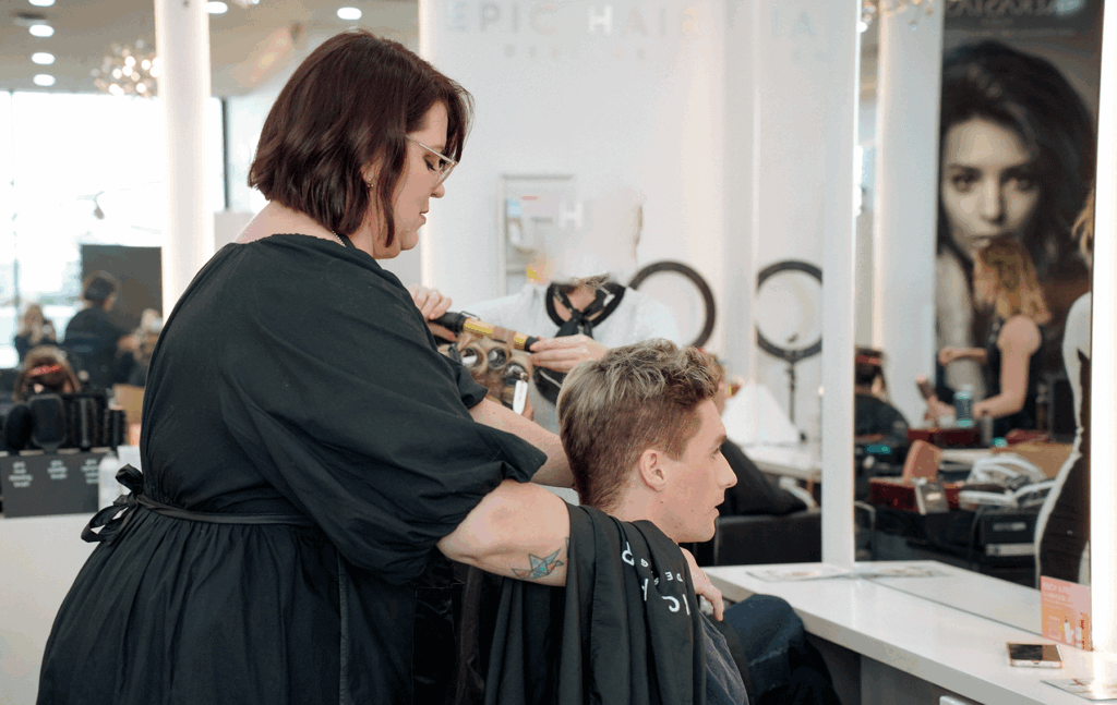 Epic stylist working with a male client during a salon appointment