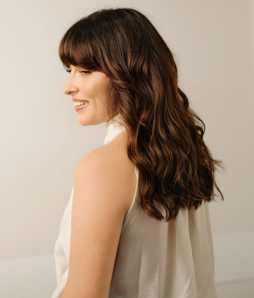 Brunette hair model with soft waves at Epic Hair Designs Brisbane
