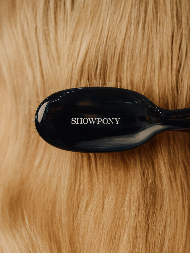 Showpony hair extension brush on blonde tape hair extensions