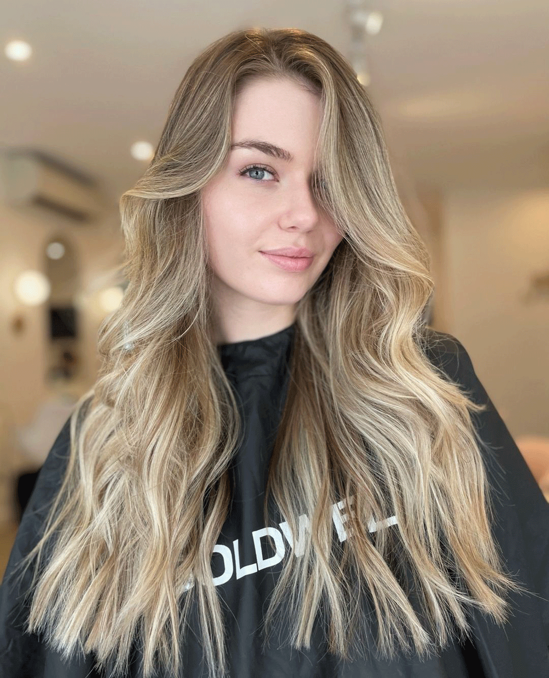 Woman with soft defined curls representing a customisable Kerasilk smoothing result