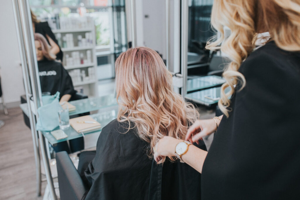 Client in Epic Hair Designs salon in Brisbane receiving a service