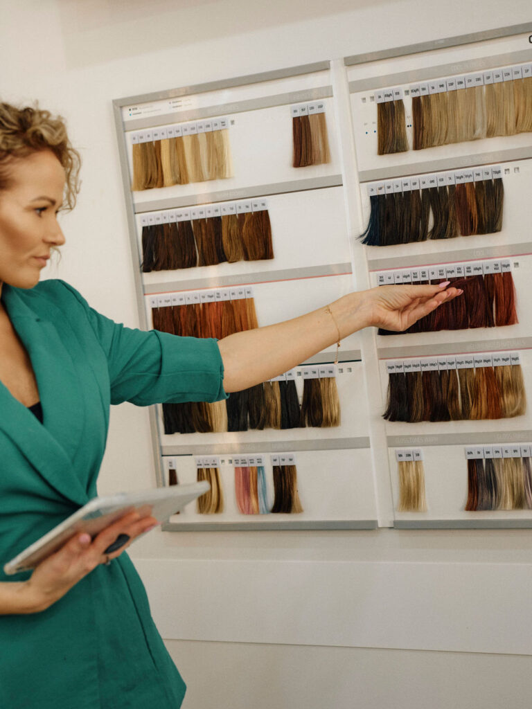 Epic Hair Designs stylist choosing professional hair colour shades for a client consultation