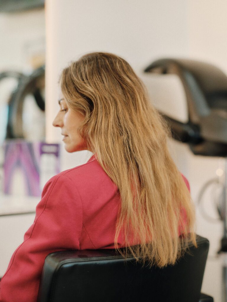 Side view of an Epic client with long honey blonde hair