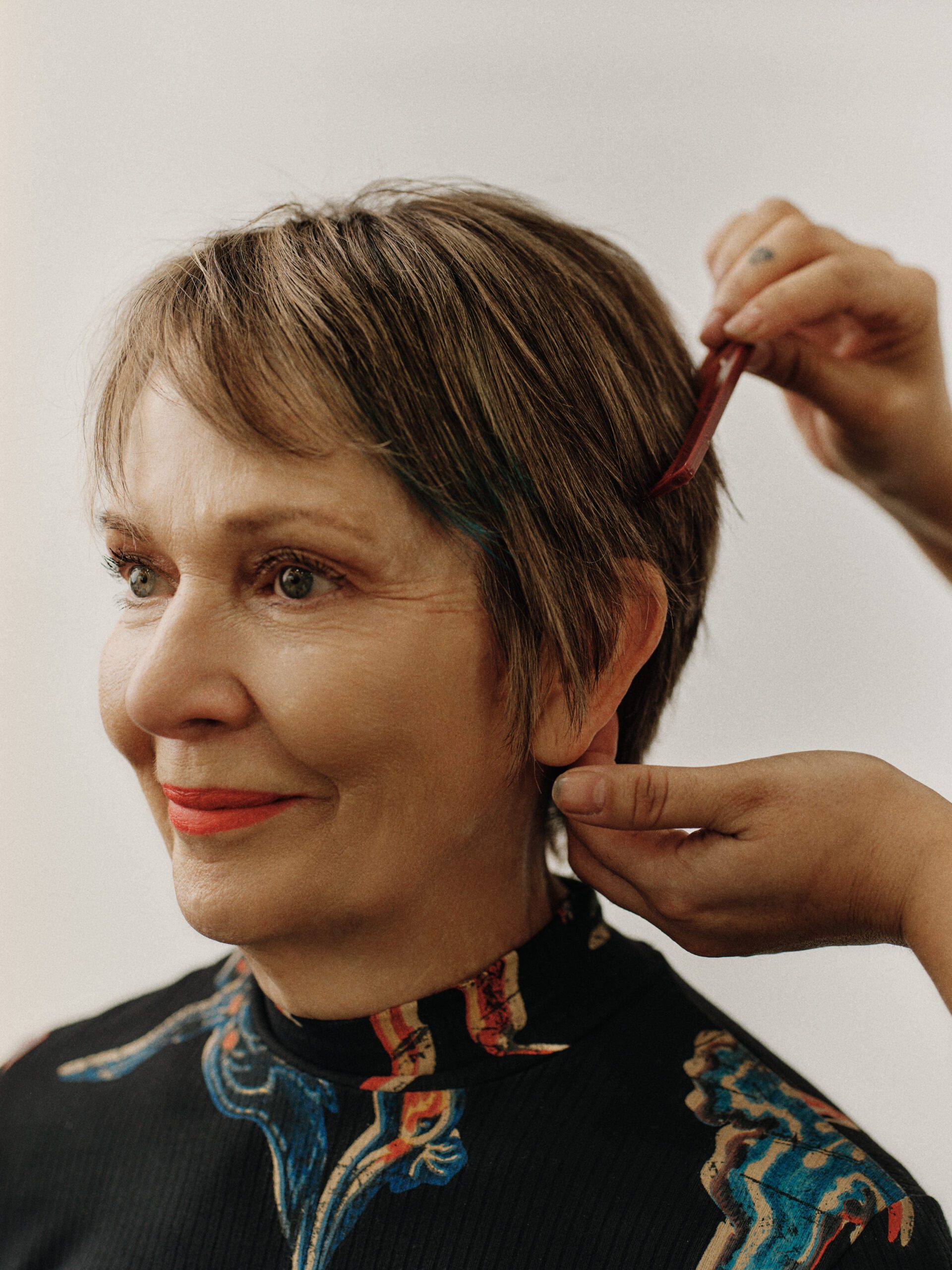 Epic Hair Designs stylist refining a client's short pixie haircut