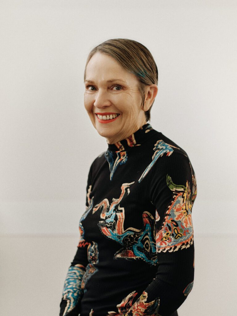 Epic client smiling with a sleek short pixie haircut